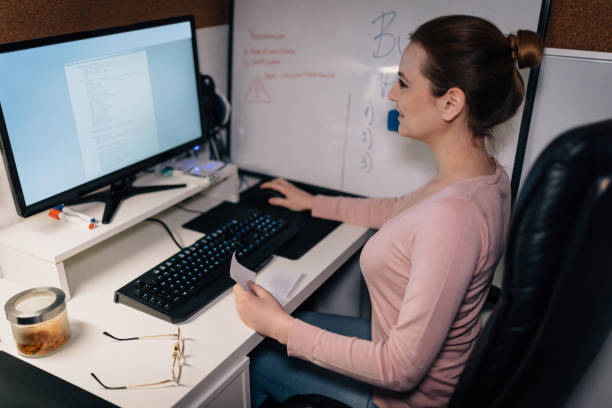 istock Young smiling woman working from home 945968702