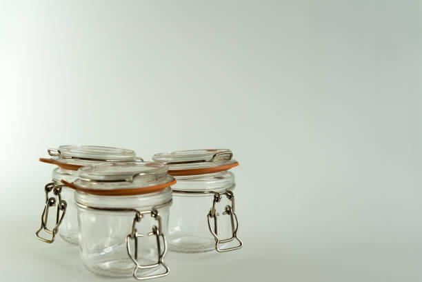 istock Set of glass jars for canning and preserving on white background 945968896