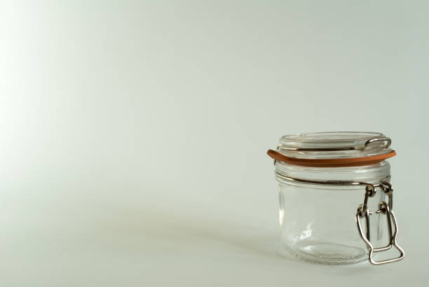 istock Glass jar for canning and preserving on white background 945968922