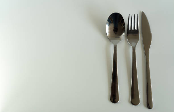 istock Set of silver cutlery on white background 945968958
