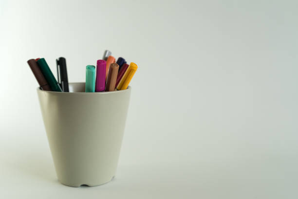istock Color markers palette in a cup on white background 945968992