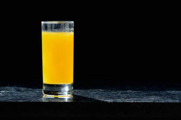 istock glass of orange juice on table in kitchen 945972526