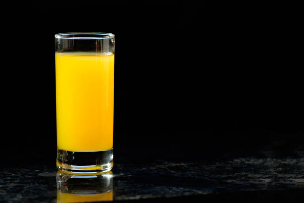 istock glass of orange juice on table in kitchen 945972538