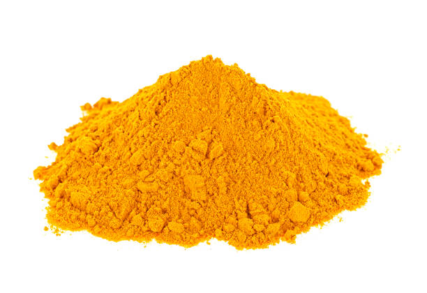 istock Pile of ground turmeric on a white background 945978126