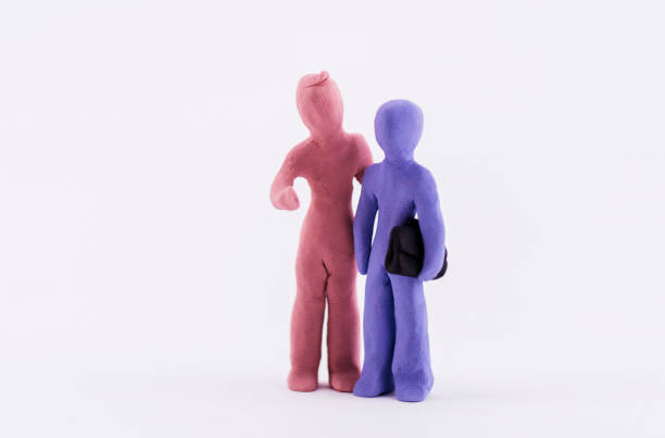 istock handmade clay figurine: businessman talking 945978654