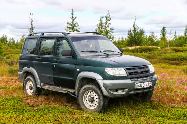 UAZ 3163 Patriot NOVYY URENGOY, RUSSIA - AUGUST 12, 2017: Off-road car UAZ 3163 Patriot at the countryside. uaz 4x4 land vehicle woods stock pictures, royalty-free photos & images