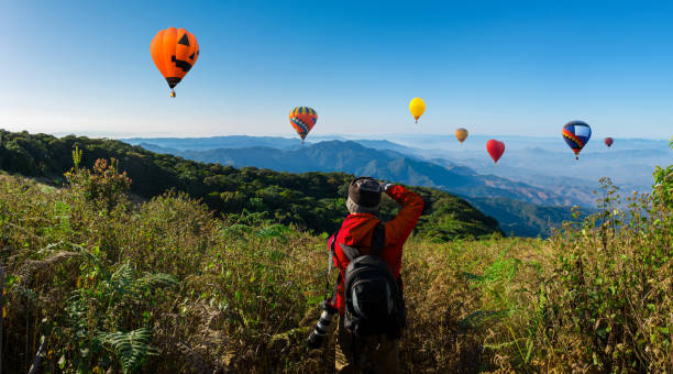 istock Panorama professional photographer take landscape photos 945982100