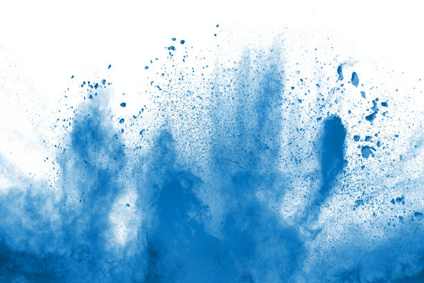 blue color powder explosion cloud isolated on white background.closeup of blue dust particles splash isolated on  background. - powder blue imagens e fotografias de stock