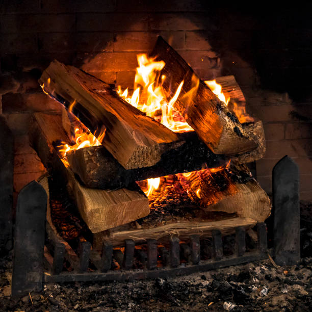 istock Fireplace Fire with Firewood Stacked Burning Wood 945984862