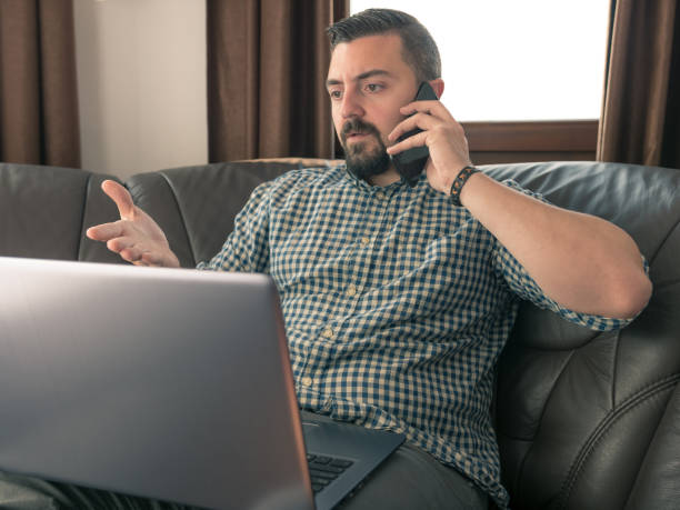 istock CEO talking on his smart phone with displeased facial expression 945985176