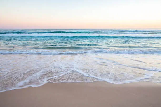 Photo of Ocean Waves on Sand Beach