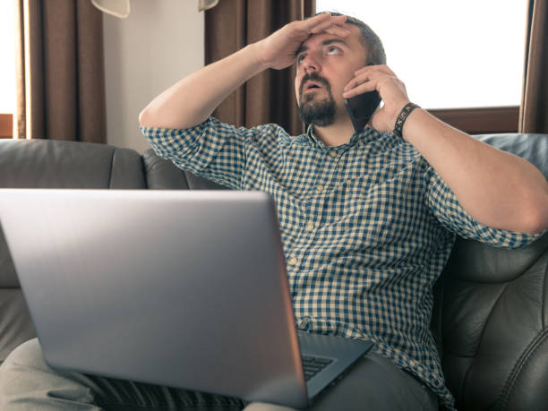 freelance worker in disbelief by his client - ceo financial advisor businessman serious imagens e fotografias de stock