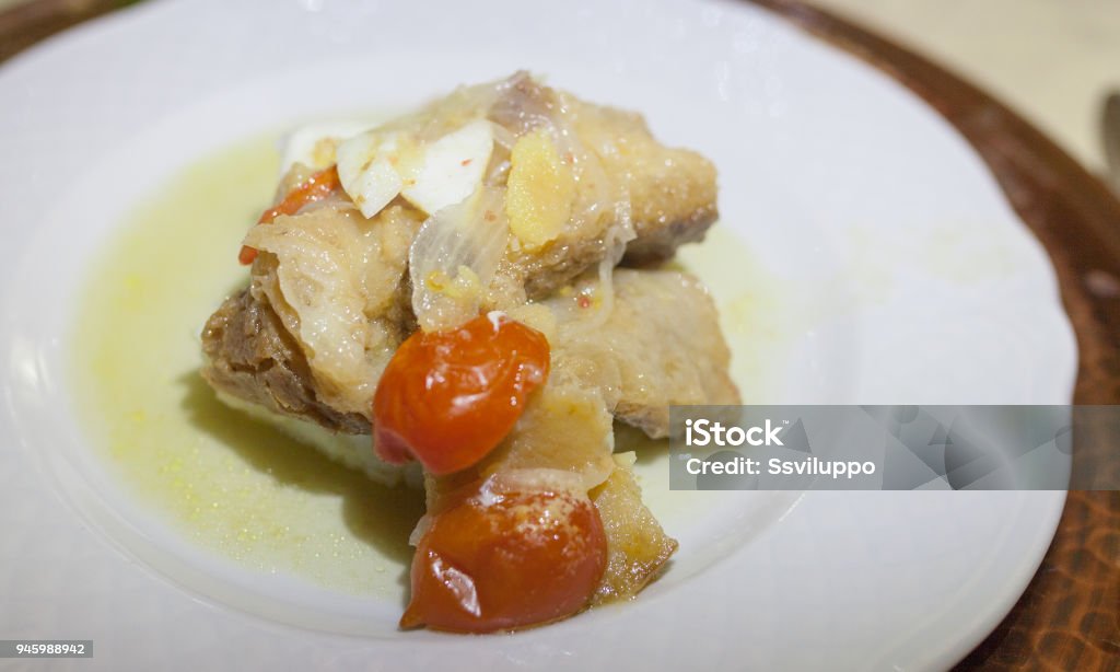 baccalã in pan dish of salt cod in low-temperature frying Baked Stock Photo