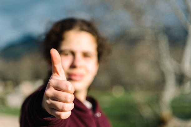 istock Girl doing thumbs up gesture 945989600