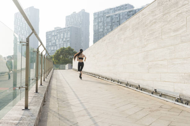 istock woman running in city 945992868