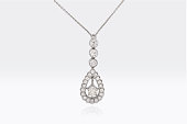 Close Up Of A Beautiful Round And Pear Shape Diamonds Pendant In White Platinum Gold Isolated On White Background