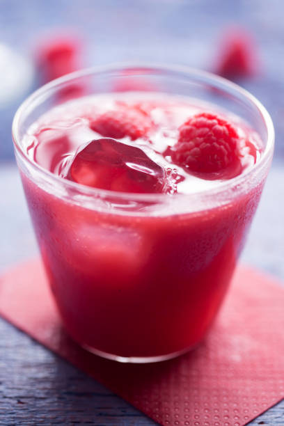 istock Summer berry juice with ice and raspberries 946000028