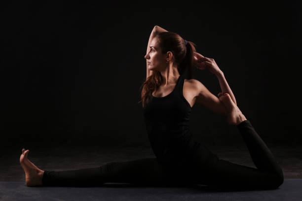 istock Young woman doing yoga 946000088