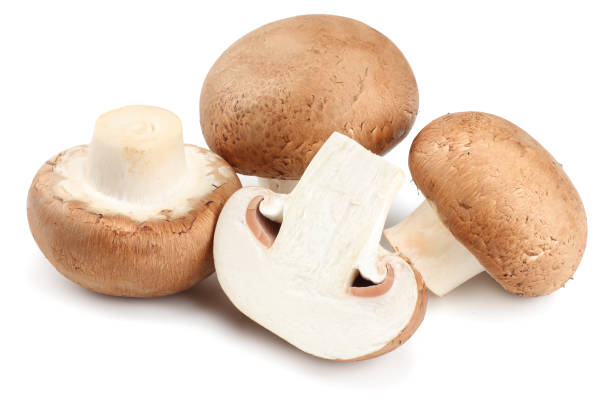 istock Fresh champignon mushrooms isolated on white background 946001404