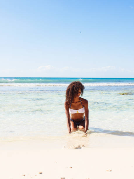 istock Young woman relaxing on the beach 946001820
