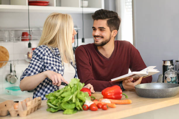 istock Young couple cooking together 946001872