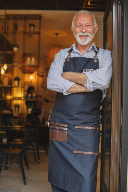istock Senior waiter waiting for guests 946008342