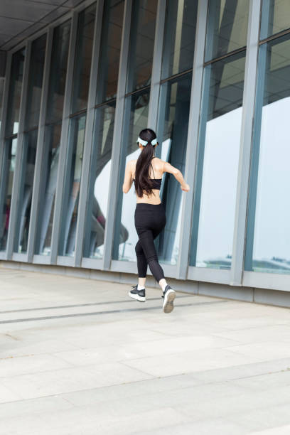 istock woman running in city 946008610