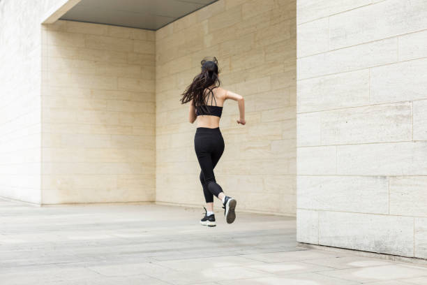 istock woman running in city 946008650