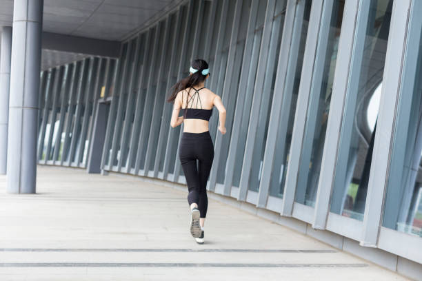 istock woman running in city 946008662