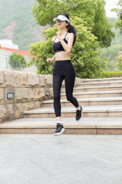 istock woman running in city 946008732