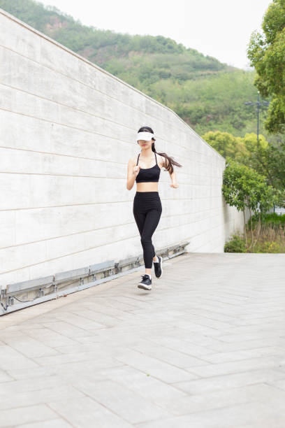 istock woman running in city 946008742