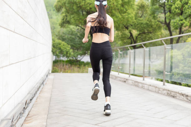 istock woman running in city 946008788