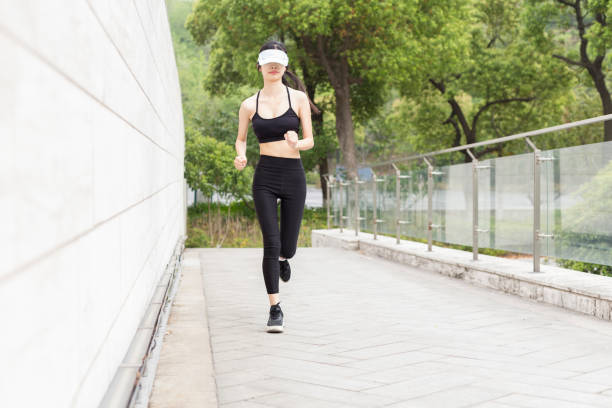 istock woman running in city 946008794