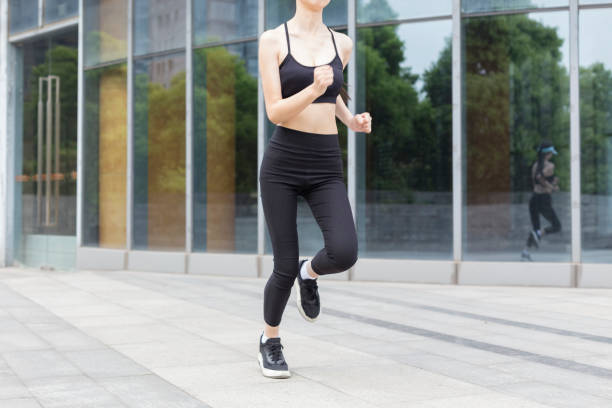 istock woman running in city 946008824