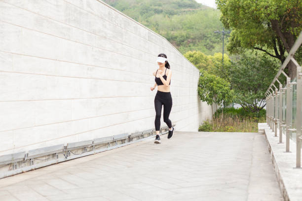 istock woman running in city 946008854