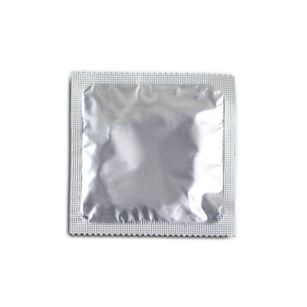 istock One condom isolated on white background. Close up 946013324