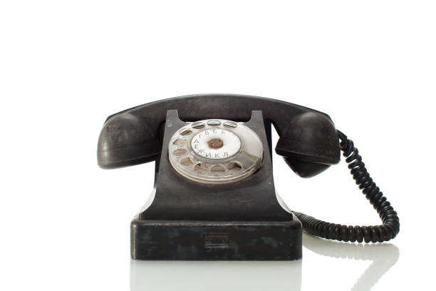 istock old black telephone isolated on white background 946013700