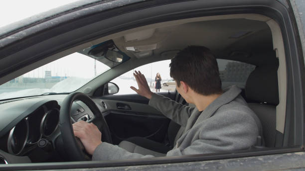 istock Young man in the car goes for his girlfriend 946014242