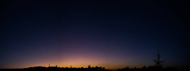 istock city sunset silhouette panaromic 946016136