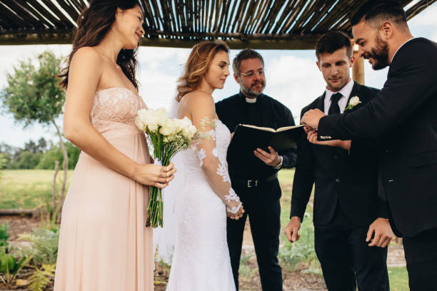 istock Rings exchange ritual at wedding ceremony 946028848