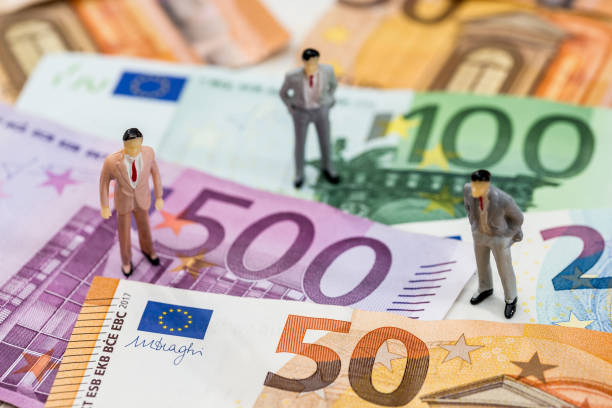 istock small toys people are on euro . 946029000