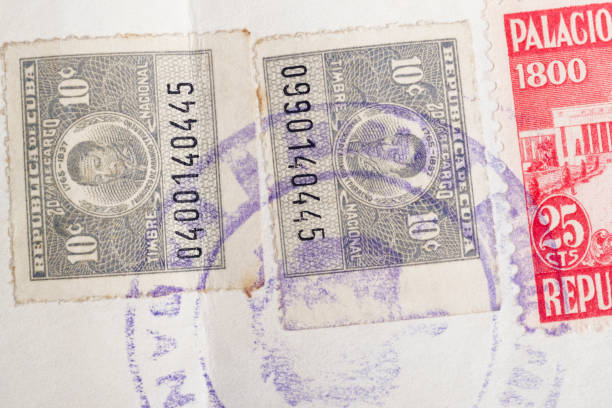 istock Antique cuban stamps with postmarks. Vintage historic philately. Postal 946029480