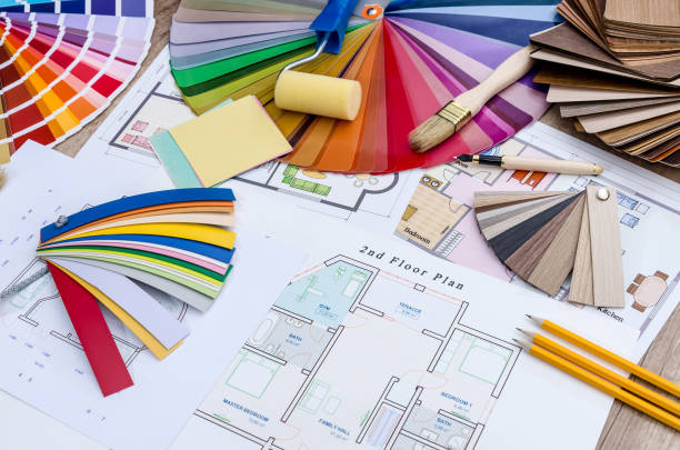 istock On the table lay the house plan, colored and wooden designs, work tools 946031816