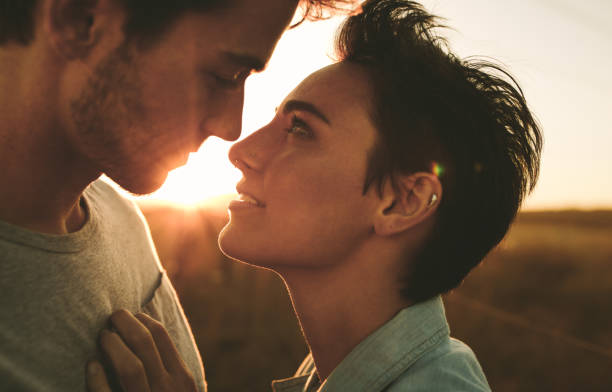 istock Couple in romantic pose outdoors 946032844
