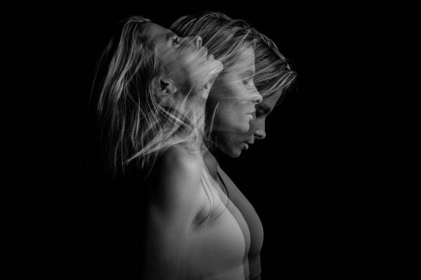 istock Beautiful phantom mystical mysterious ambiguous original conceptual profile side portrait of young blonde woman on a black background. Black and white photo. triple exposure. 946039492