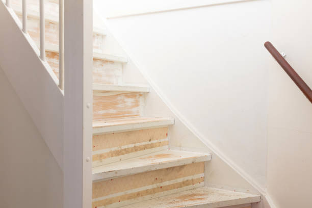 istock Removing carpet, glue and paint from an vintage stairs 946040038