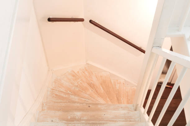 istock Removing carpet, glue and paint from an vintage stairs 946040104