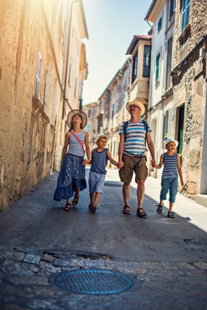 istock Father and kids sightseeing mediterranean town on Majorca 946040146