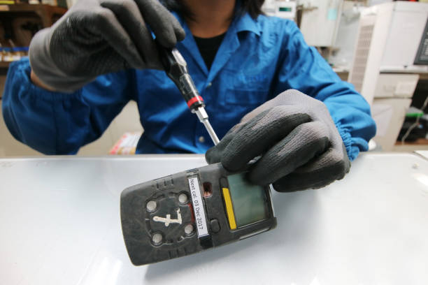 istock Instrument technician is repairing or function check of personal gas tester or gas detector for the job calibration of gas. 946040372