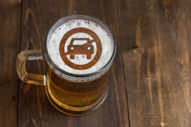 Concept of safe driving. Sign not allow Car access on the beer foam in glass stock photo